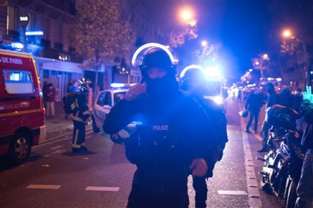 Elite police officers arrive outside the Bataclan theater in Paris, France